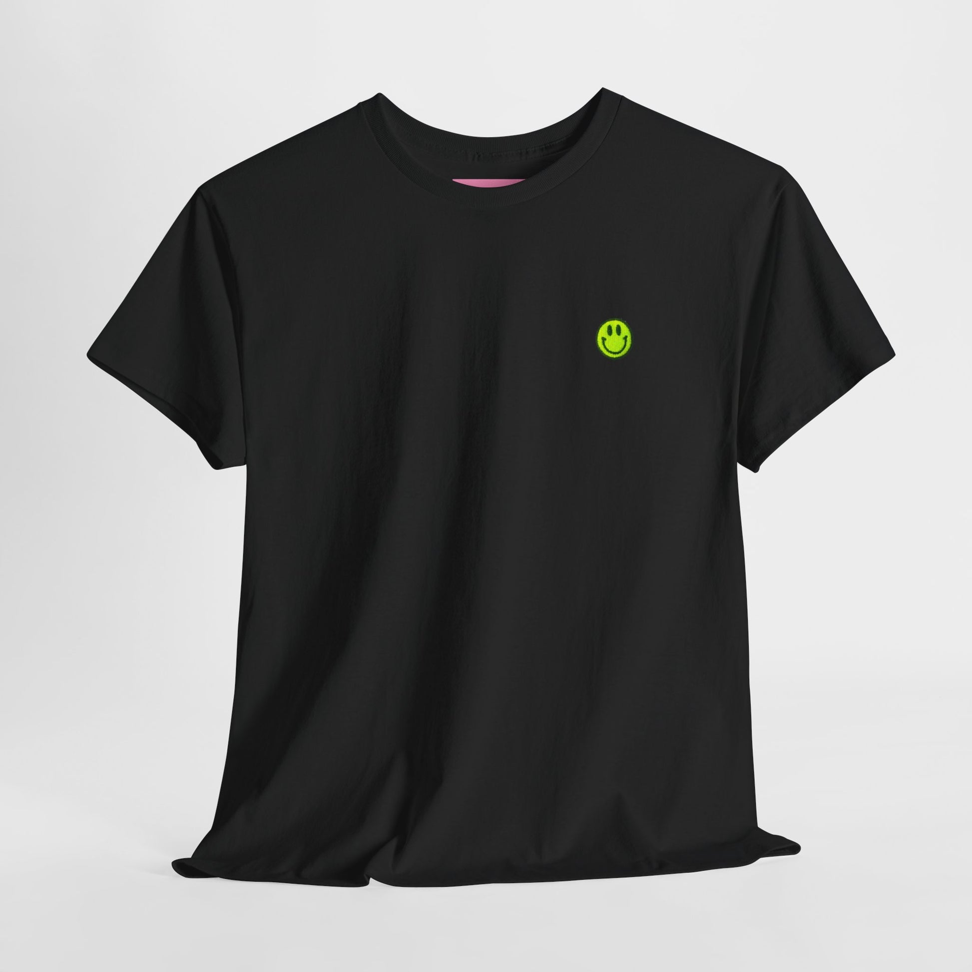 Close-up flat lay of neon yellow embroidered acid smiley face on black t shirt