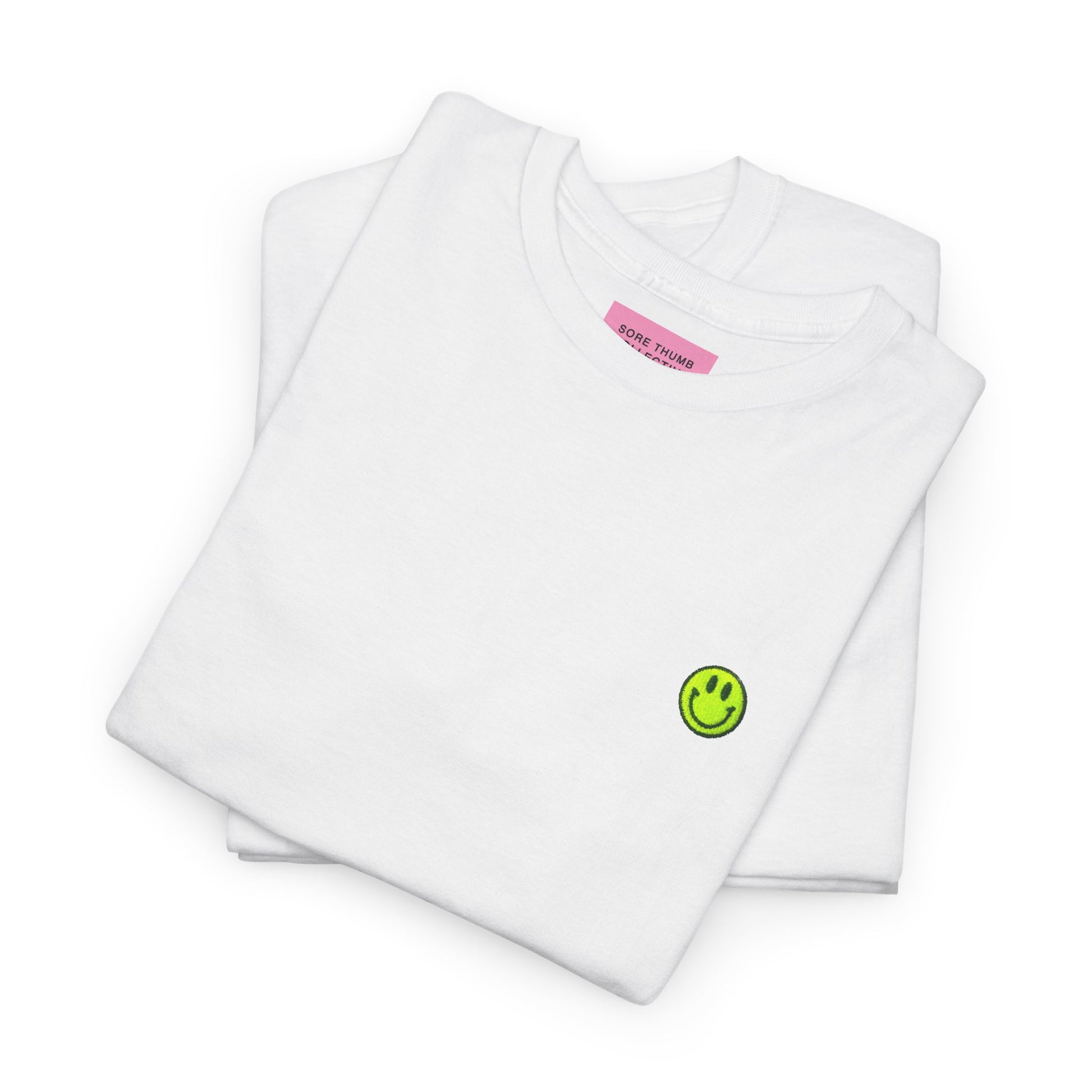 Folded white smiley face t shirt with neon yellow embroidery, 90s retro rave style