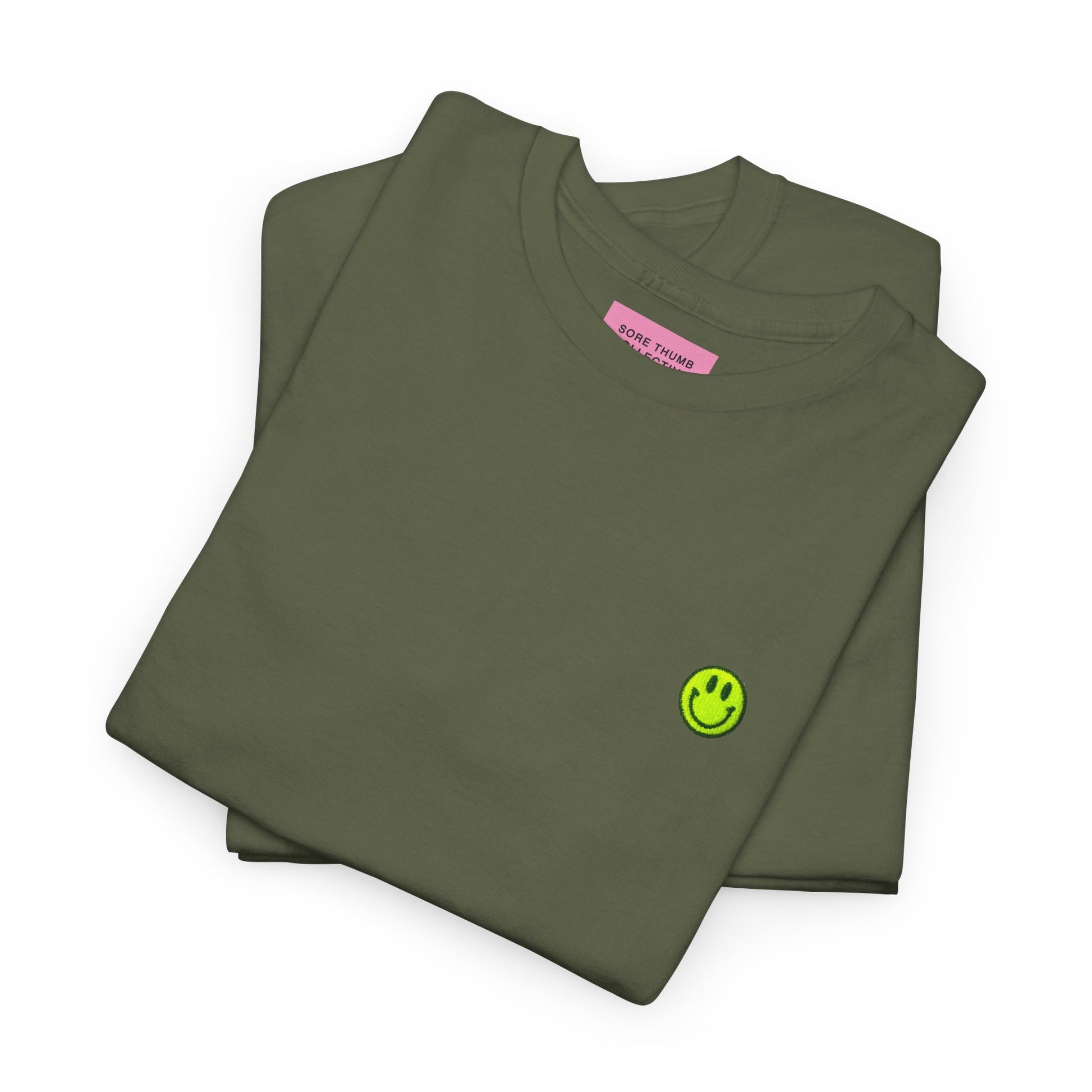 Folded green t-shirt with a small logo on a white background