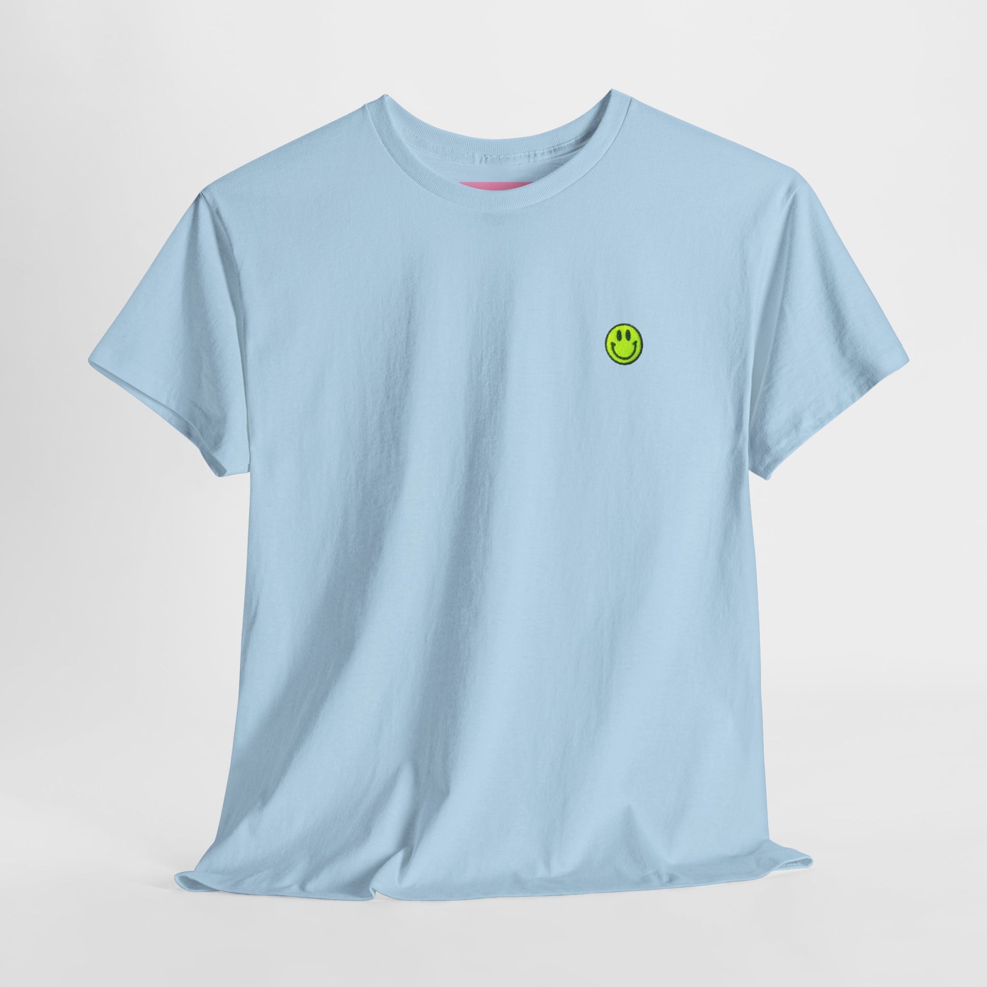 Light blue t-shirt with a green smiley face logo on a light gray background