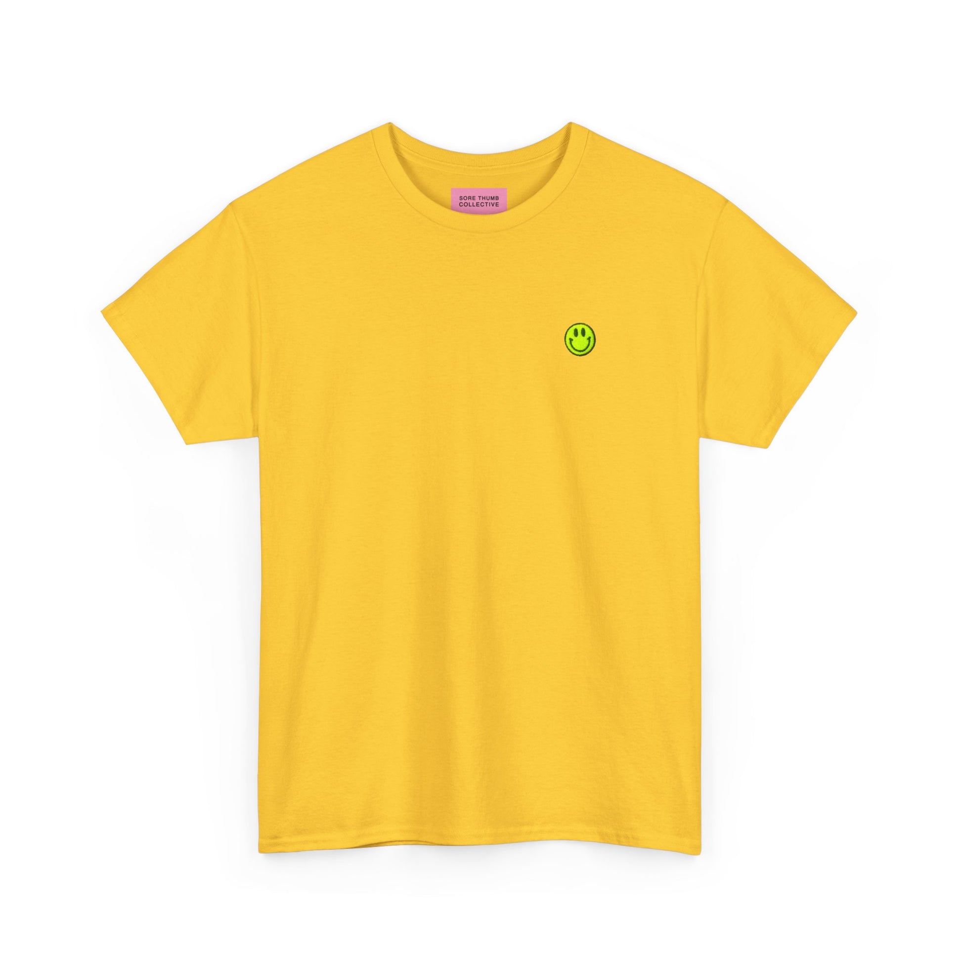 Yellow t-shirt with a small smiley face logo on a white background