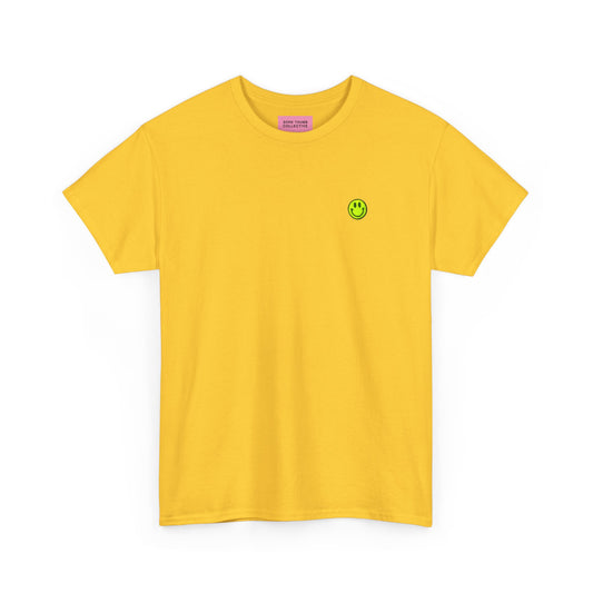 Yellow t-shirt with a small smiley face logo on a white background