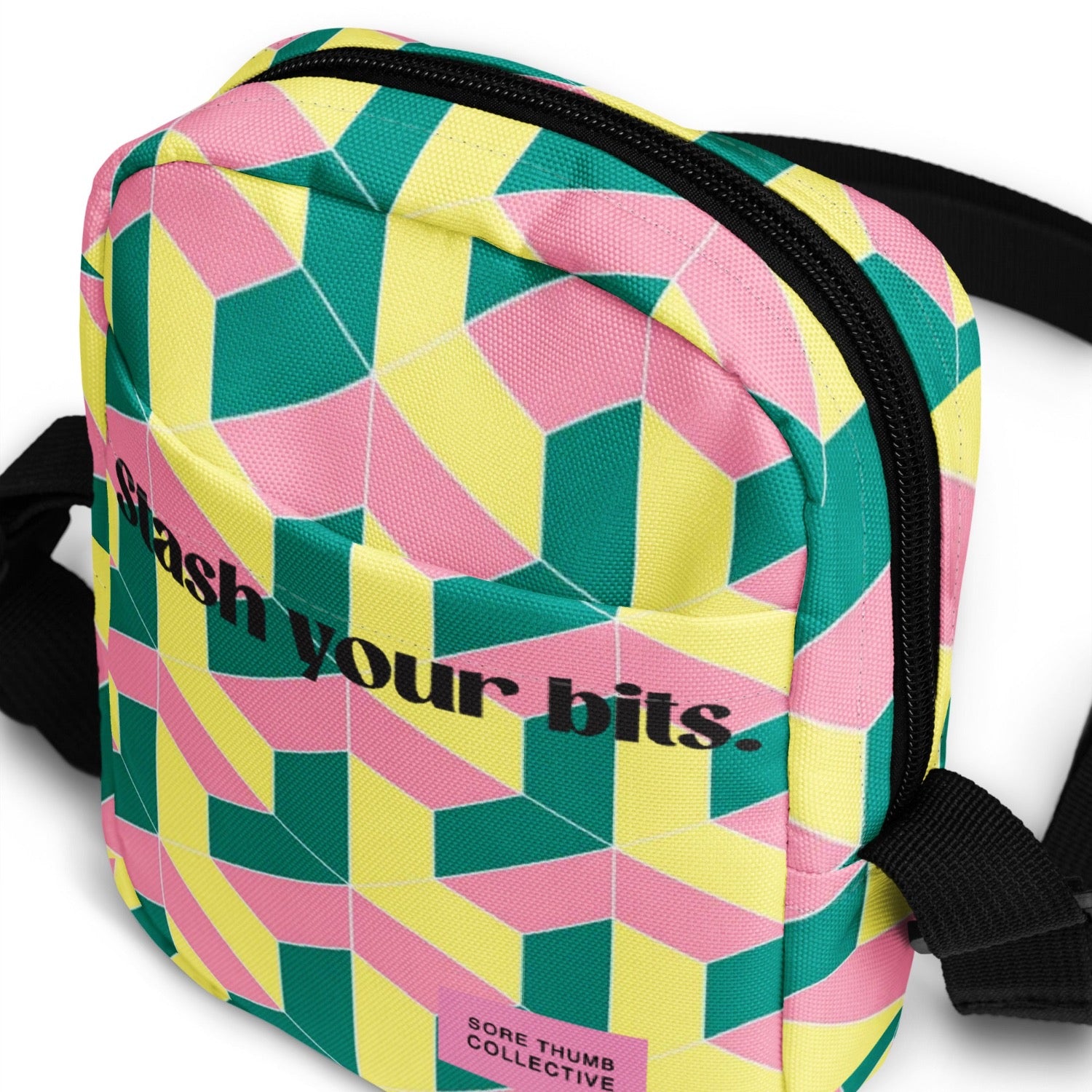 Cross body bag with geometric print, slogan on front, string shoulder strap, utility bag styling, perfect for festivals and raves